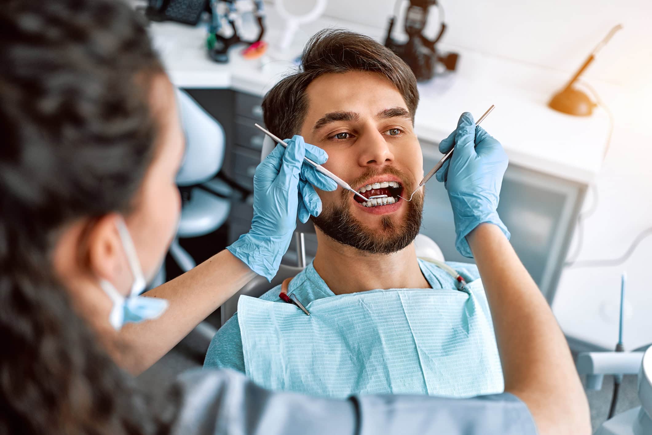 Medicine, dentistry. A visit to the dentist. Close-up portrait of a patient with teeth with braces.